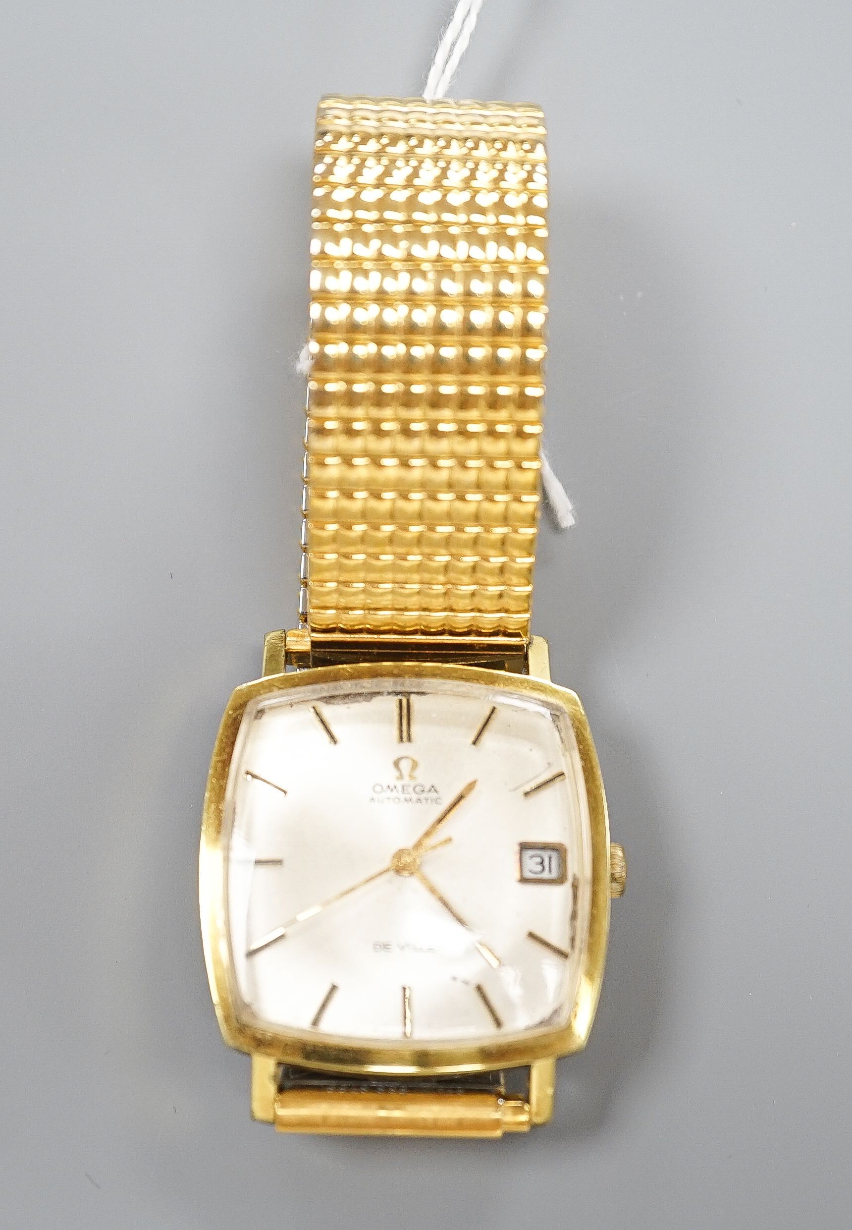 A gentleman's steel and gold plated Omega De Ville automatic wrist watch, on associated flexible strap, case diameter 32mm, no box or papers.